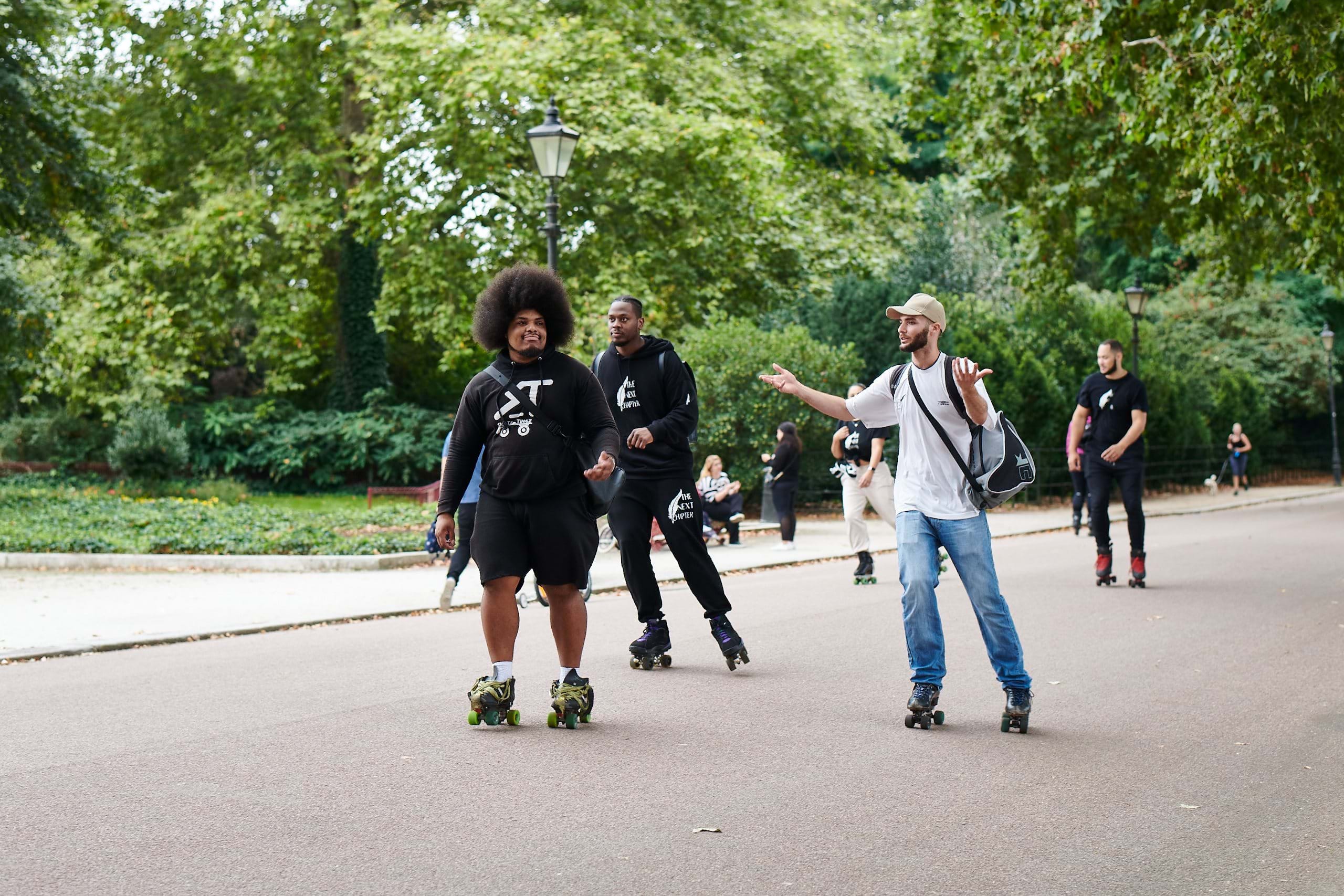 Men roller-blading in Battersea Park